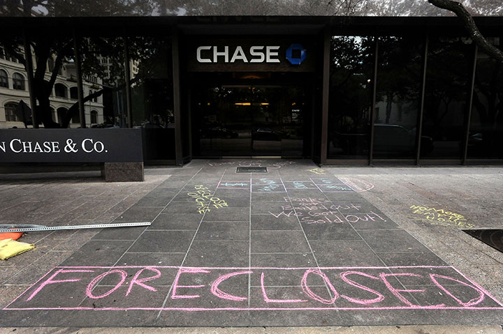 Occupy Austin leaves chalk graffiti outside a Chase Bank