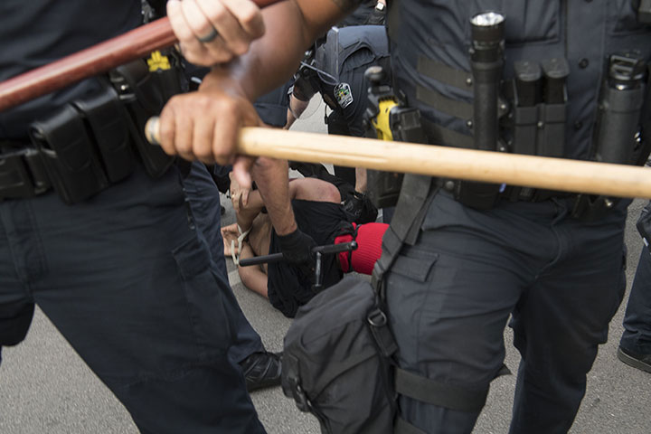 Police arrest a protester