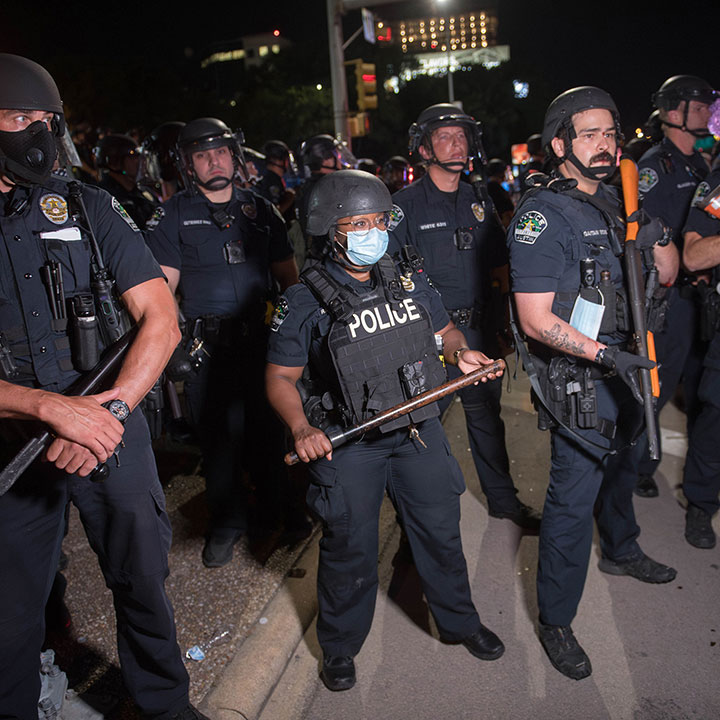 Police respond to protesters gathered outside their headquarters
