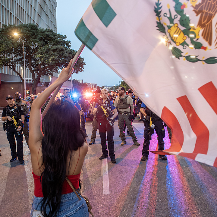 police confront protesters during a solidarity with Los Angeles protest against ICE near Austin's federal building