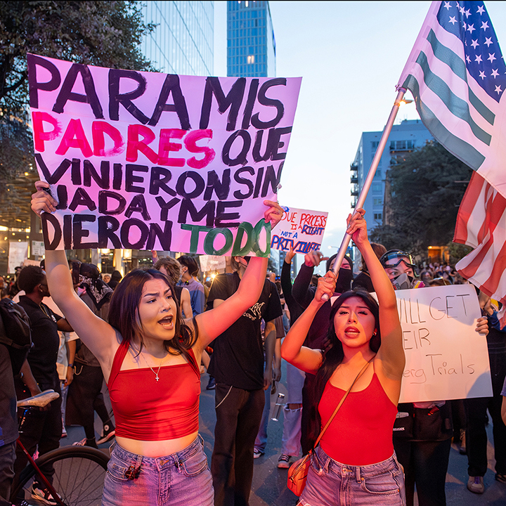 police confront protesters during a solidarity with Los Angeles protest against ICE near Austin's federal building