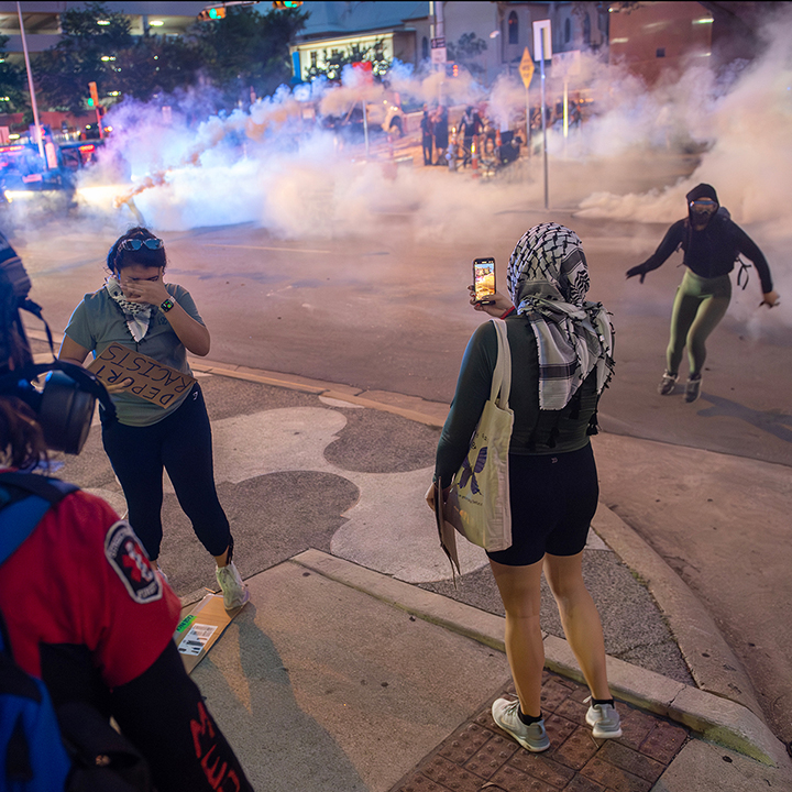 police arrest a citizen journalist during a solidarity with Los Angeles protest against ICE near Austin's Federal building