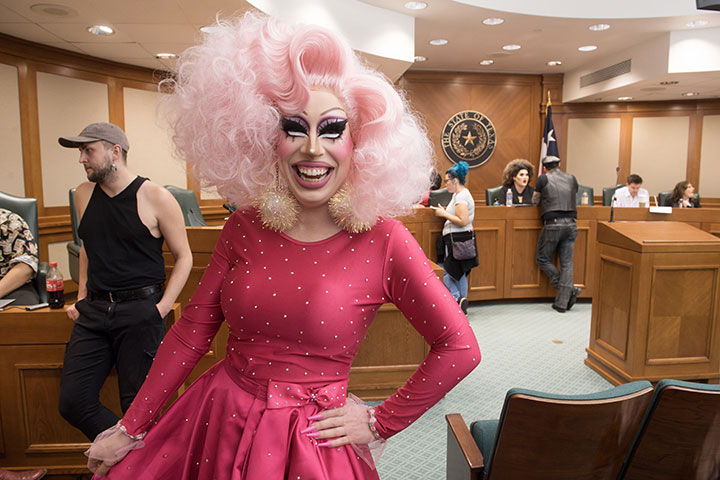Drag performer Brigitte Bandit poses while waiting to testify before the Texas Senate State Affairs Committee