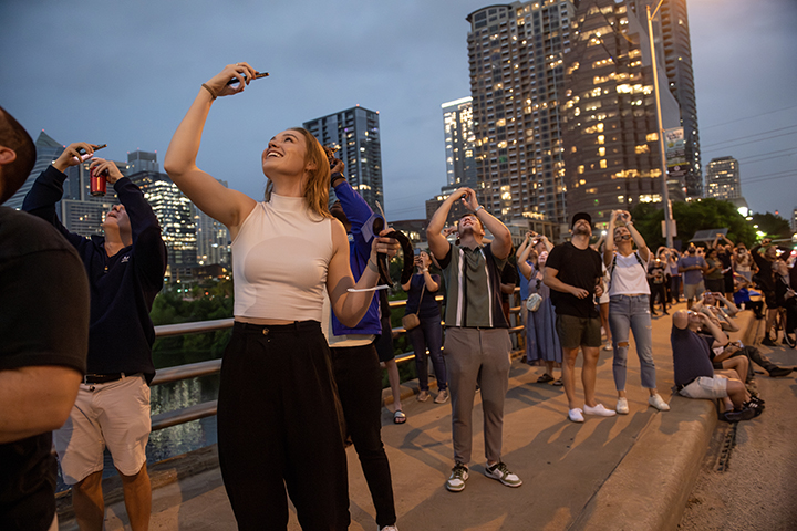 People gather on the Ann W. Richards Congress Avenue Bridge to watch the total solar eclipse in Austin, Texas