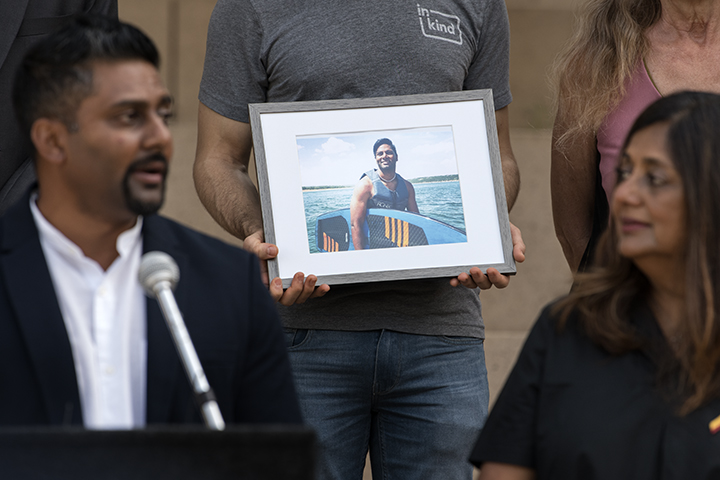 Mark Moonesinghe speaks during a press conference at Austin City Hall about the fatal police shooting of his brother, Rajan Moonesinghe