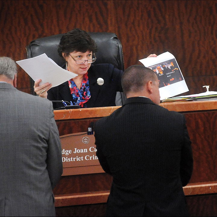Judge Joan Campbell questions a prosecutor about a photograph of undercover Austin police officers