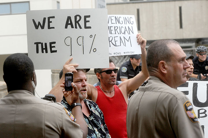 Occupy Austin protests a foreclosure auction at the Travis County Courthouse