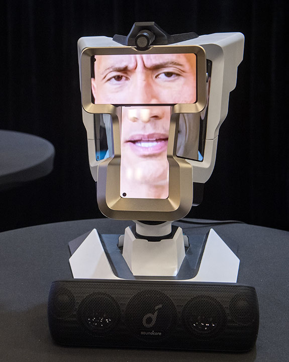 A Wehead video communication device shows Dwayne Johnson’s face at the Creative Industries Expo during South by Southwest 2023
